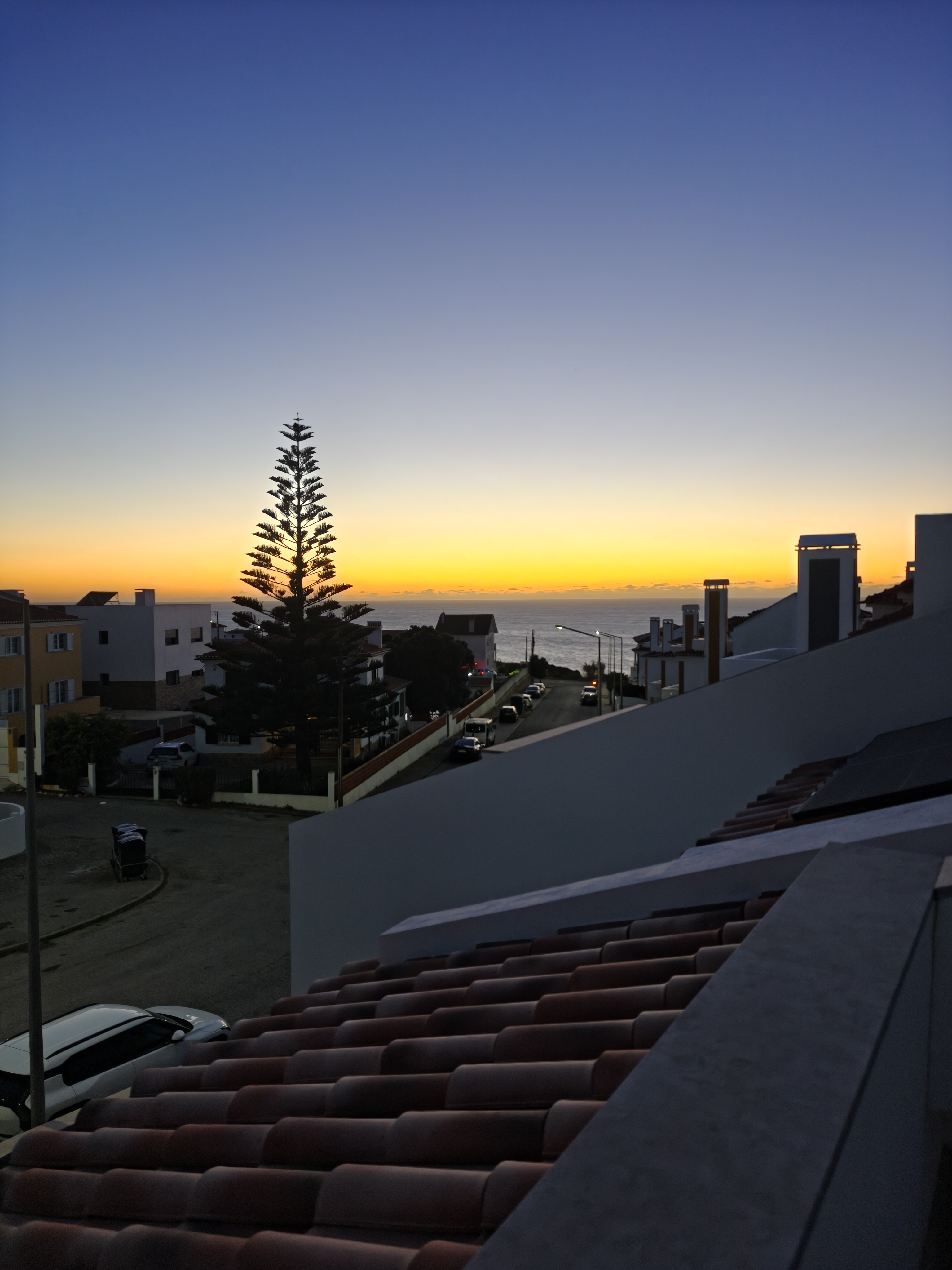 Sunset over the rooftops and Atlantic